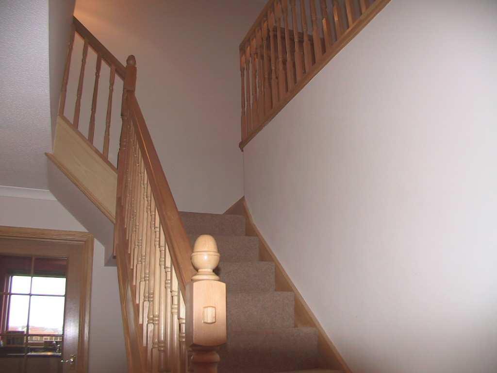A truly impressive staircase with attractive wooden balustrade leads from the hall to the upper floor accommodation.
