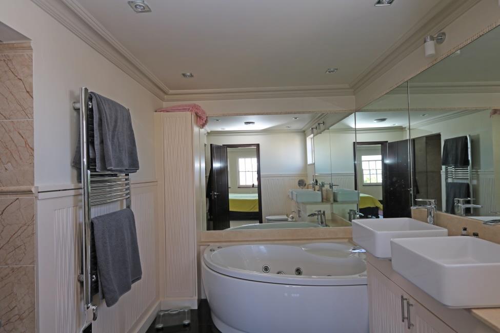 suite bathroom 9 7 x 7 3 and 10 Fitted with a five piece suite in white comprising walk-in fully tiled shower cubicle, spa bath with water flow tap and