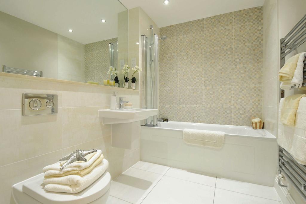 Hotel-style bathrooms and en suites blend white sanitaryware with chrome fittings and quality tiling for both