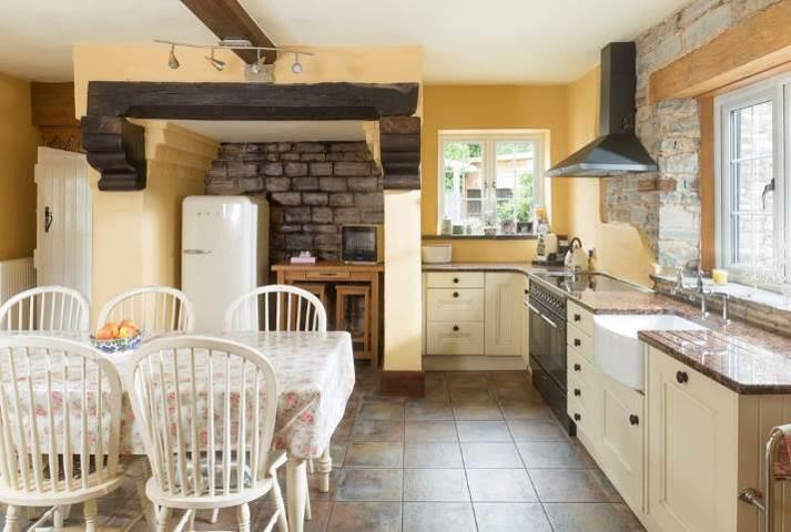 HALL with flagstone floor, large storage cupboard with quarry tiled floor and cloaks cupboard. Access to cellar.