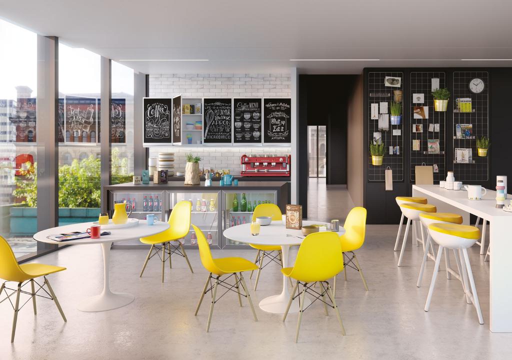 The coworking space on the first floor is surrounded by social spaces, including a lounge, kitchen and an open-air roof terrace.