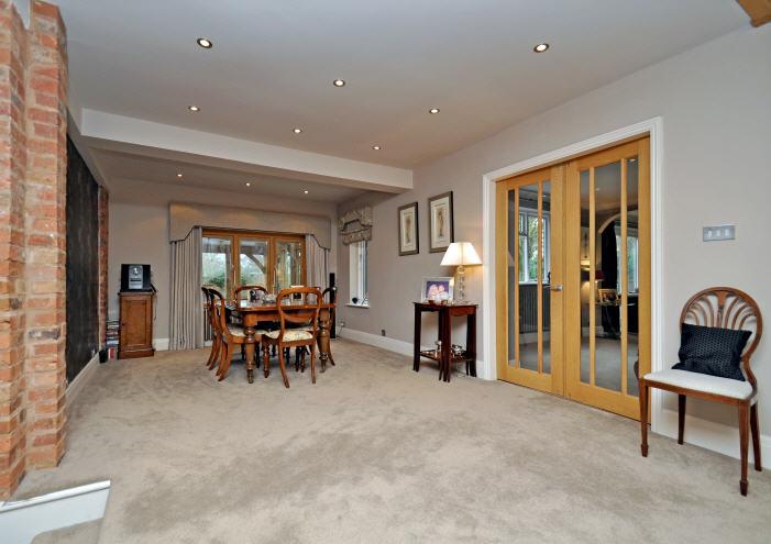 ACCOMMODATION A panelled front door leads to an ENTRANCE HALL with steps leading to a well appointed, contemporary CLOAKROOM and a superb open-plan, galleried RECEPTION HALL beyond with oak flooring,