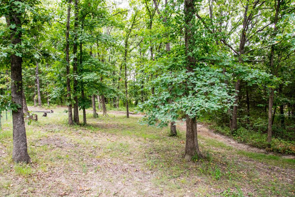 Beautiful Country Home on Five-Acre Wooded Oasis Situated on five wooded acres, this beautiful country home is just ten miles from Pomme de Terre Lake and only four miles from Bolivar High School in