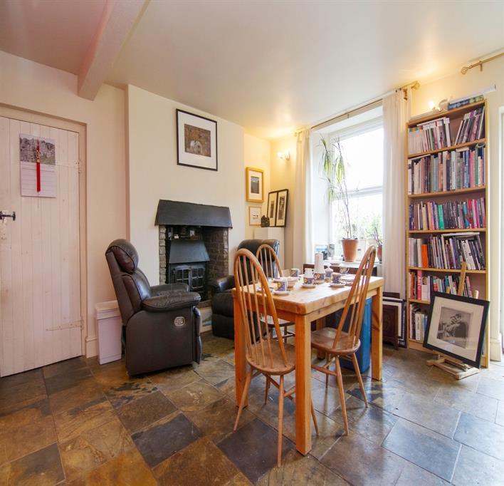 Exposed stone wall. Tiled floor. Double glazed French doors to the side garden and patio. Open tread staircase to the first floor annexe landing.