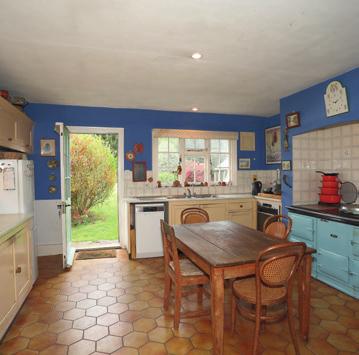 later extension on the west side, comprising a generouslyproportioned kitchen with an Aga, an adjacent breakfast room, utility room, boot room, a ground floor bedroom and two bathrooms; four