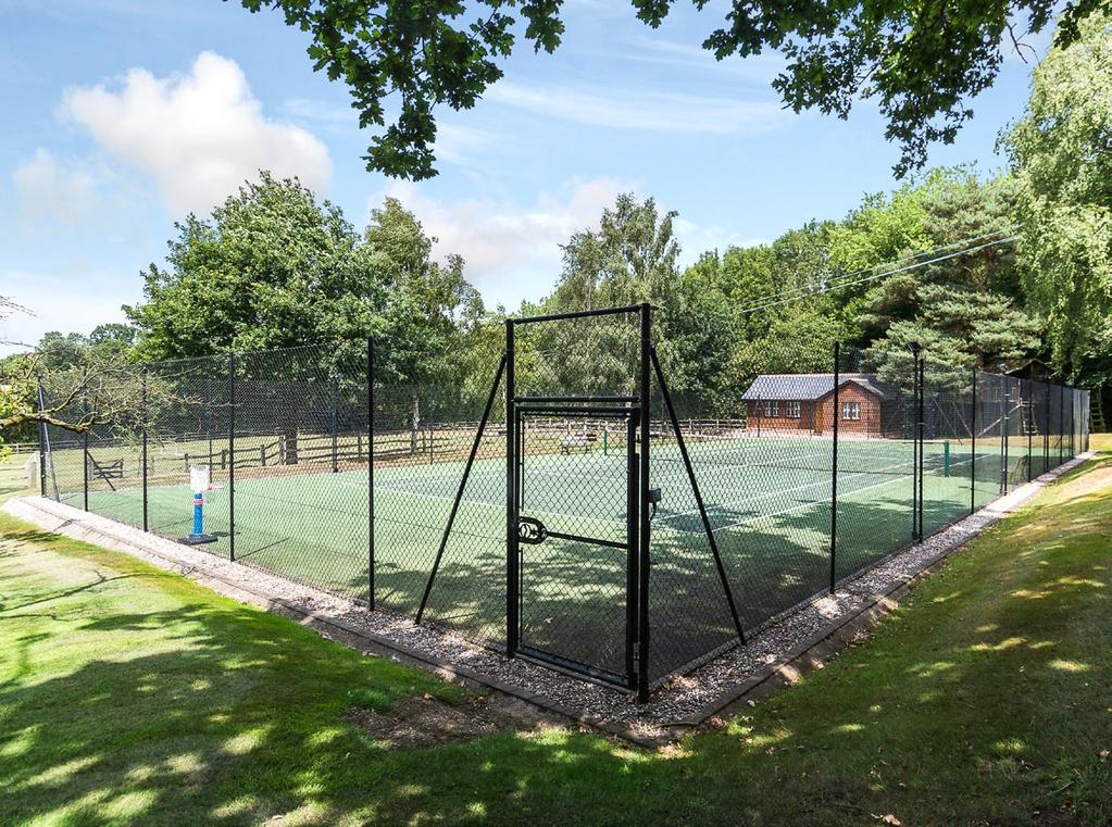 Outside The rear gardens have been lovingly maintained and are well considered in their landscaping, opening to a lovely tennis court with extensive