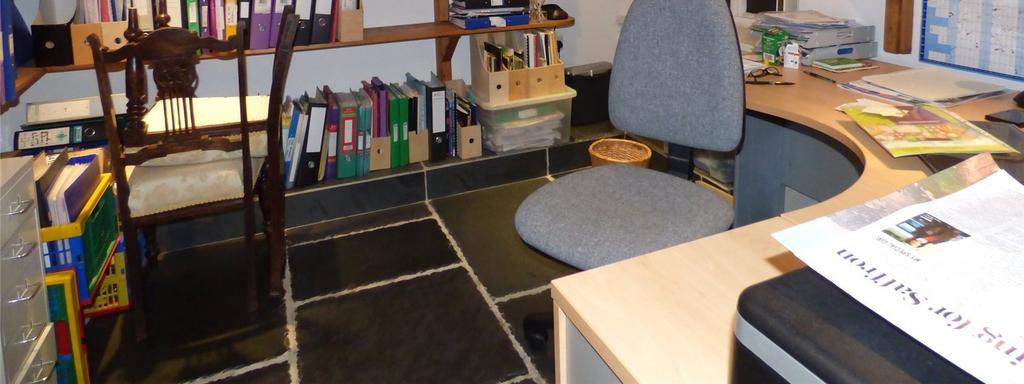 which has been made into a spacious office with slate tiled
