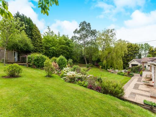 The property has been extensively refurbished throughout and benefits from a modern fitted kitchen and bathroom, a double garage with power and lighting, a stable block, stunning large lawn gardens