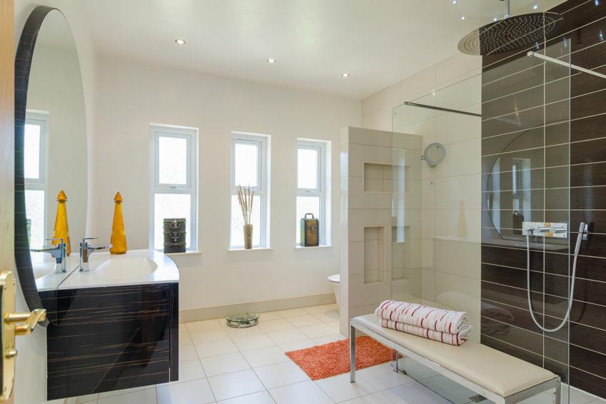 ENSUITE BATHROOM: Vanity unit with marble sink, storage and integrated mirror, low