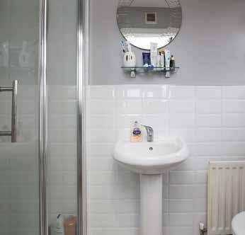 ENSUITE: Fully tiled shower cubicle with
