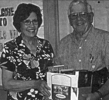 BOOKS FOR BUFFALO VALLEY Faye and John Loyd of Lebanon are pictured with the books they donated to the Buffalo Valley Library at the August birthday party held at