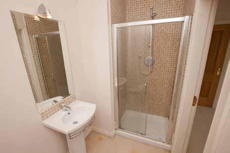 9m) BATHROOM: White suite comprising panelled bath with mixer taps and telephone