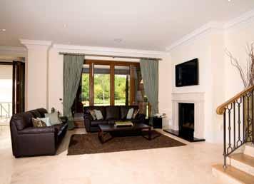 motorised reclining leather reception hall with limestone flooring, elegant Adjacent is the drawing room with parquet microwave, Sub Zero stainless steel American style cinema furniture for seven,