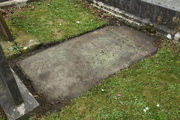 POSITION See Plan D15 Headstone, lying flat. Surface generally worn, but text still legible.