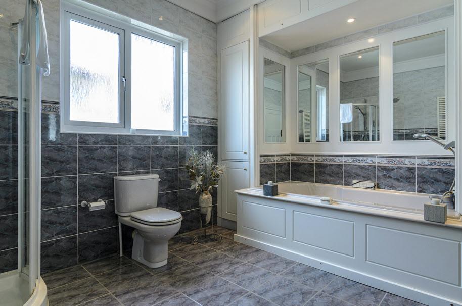 MASTER BEDROOM: 15' 6" x 14' 9" (4.72m x 4.5m) Plus built-in robes. ENSUITE SHOWER ROOM: Tiled shower cubicle, pedestal wash hand basin, low flush wc, tiled walls and floor, down lighting.