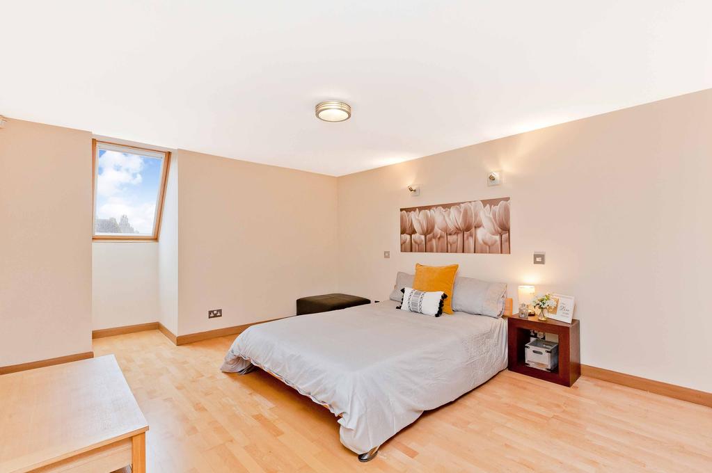 Returning downstairs, the second double bedroom enjoys equally impressive proportions and a built-in