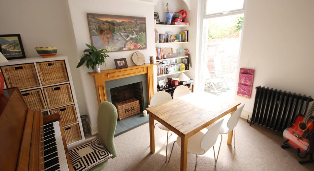 ) Accessed directly from the spacious hallway, the dining room has french style patio doors opening out to the rear garden, allowing light to flood into the room.