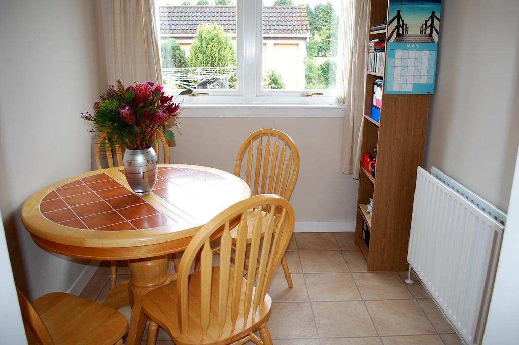 Dining Room: 8 10 x 7 01 Positioned adjacent to the kitchen this dining room has a window overlooking the back garden