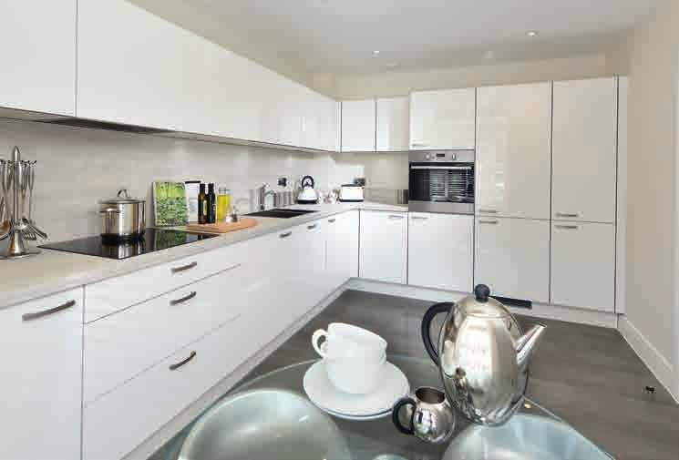 for freestanding washer / dryer within utility cupboard Stainless steel one and a half bowl sink with chrome mixer tap LED under wall unit lighting Chrome power sockets above worktops Kitchen