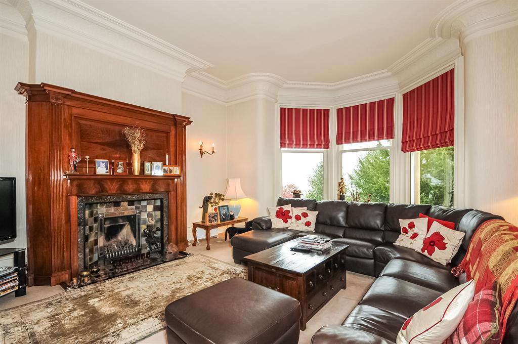 - Family Room: A spacious room with splay- bay window offering magnificent views over the gardens and including period fire place, tall ceilings and ornate plaster work - Sitting Room: Again with a