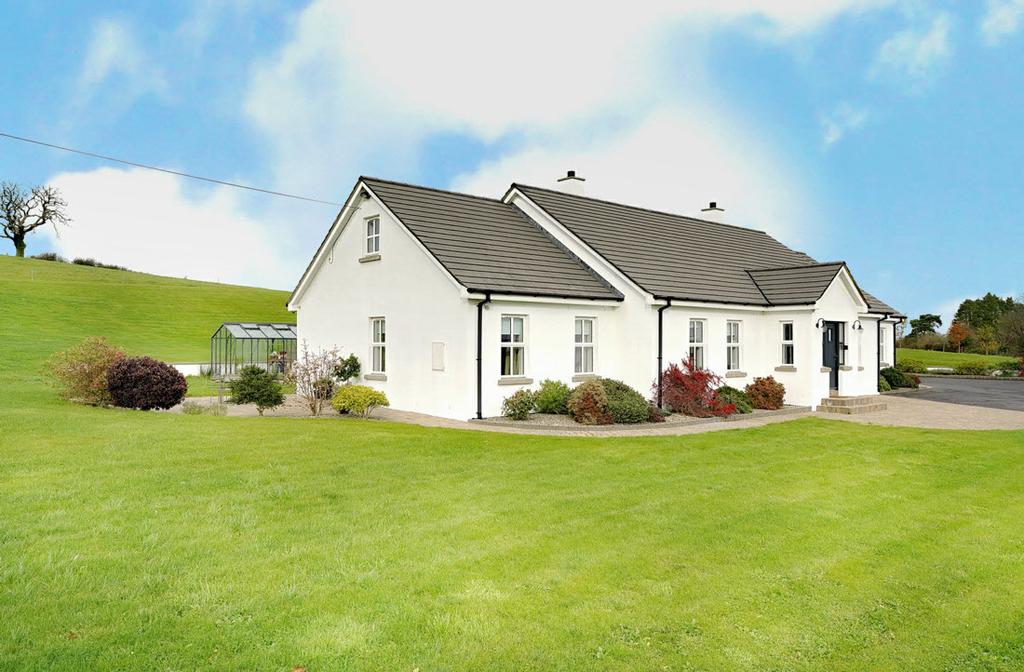 A charming, detached family home situated on a superb, elevated site nestled within some of County Down s most idyllic scenery.