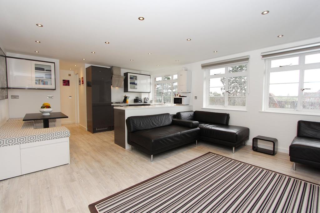 A beautifully refurbished fourth floor penthouse apartment with delightful south facing