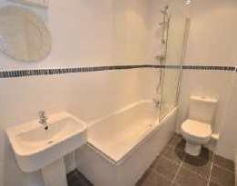 Bathroom 8'0" x 5'2" (2.44m x 1.58m) The smart family bathroom enjoys a matching white three piece suite comprising panelled bath with mixer shower fitted over and fixed shower screen.