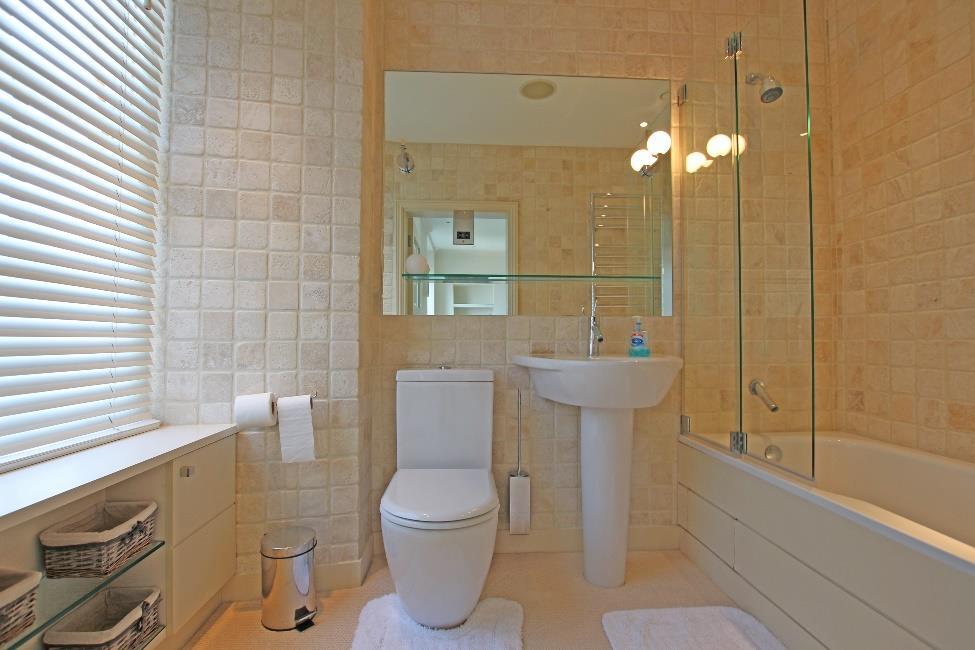 En Suite Bathroom 8 11 x 5 6 Fitted with a 3 piece white suite comprising bath with shower over, wc and