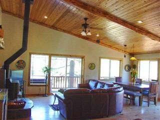 Enjoy the rustic character with massive log posts, log accents and pine