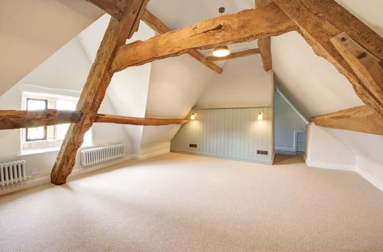 FIRST FLOOR Exposed ceiling beams. Staircase to second floor. Bedroom 3 Cotswold stone mullioned windows overlooking the village. Exposed beams. Deep wardrobe cupboard.