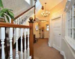 ENTRANCE HALL Solid wood entrance door leads to a spacious and welcoming entrance hall boasting a wide range of original period features including deep skirting, dado rail, picture rail, deep coving