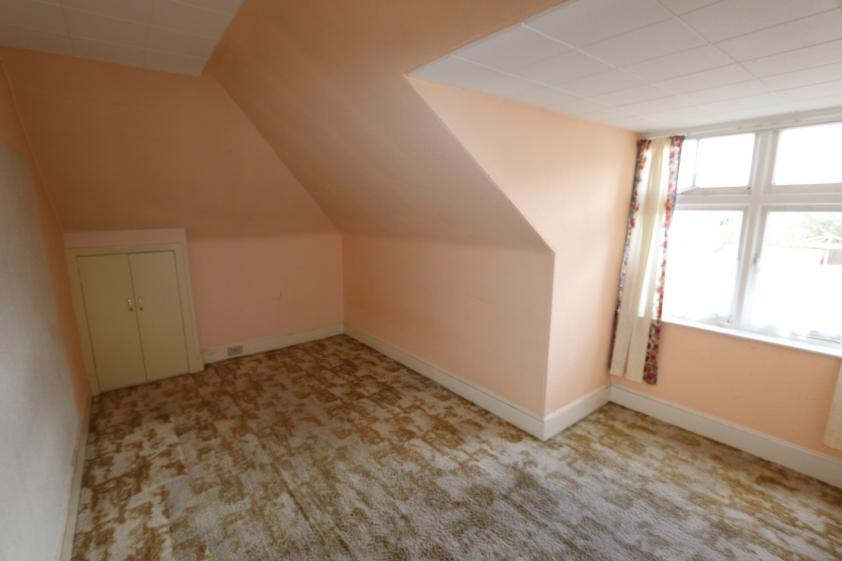 89m or thereby with coombed ceiling. W.C. Sink incorporated into unit. Small window. Radiator. Bedroom 1 measuring 4.83m x 3.