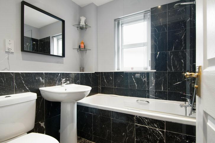 BATHROOM: Modern white suite comprising low flush wc, pedestal