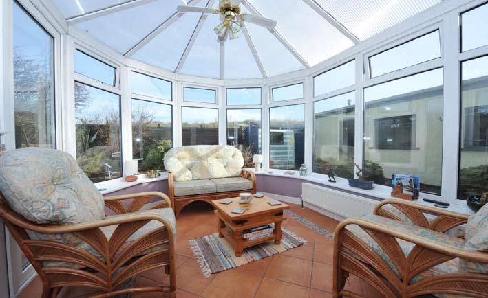 ACCOMMODATION GROUND FLOOR PVC door to... ENTRANCE HALL: Wooden floor. LIVING ROOM: 14' 4" x 11' 5" (4.37m x 3.48m) Feature fireplace with wood surround and open fire. Tiled hearth and inset.