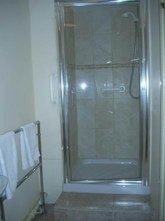 Ground Floor Shower Room Door opens to 710mm WC is 470mm with grab rail to