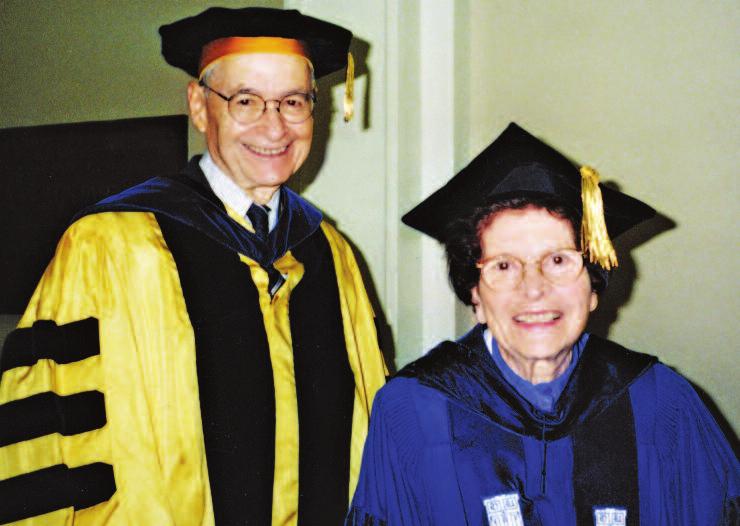 Charles, right, speaks with Donald Fox, left, a colleague and member of the Urban Livability Program s faculty advisory board, while Shirley speaks with Dean Linda Dykstra, September 2003.