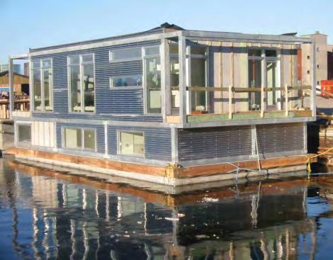 Floating Home Sea Living HUBB03 Residential floating home delivered spring 2003. Cladding sinus shaped aluminium plating, windows aluminium.