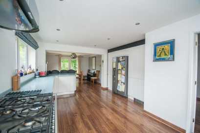 KITCHEN / DINING ROOM An impressive open plan room incorporating a beautifully fitted Kitchen with Dining Area and double doors onto the rear garden.. KITCHEN AREA 5.21m X 2.