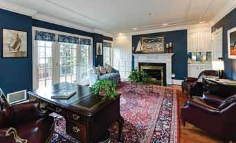 Generous, light filled rooms with rich architectural detail such as, six panel doors, deep moldings, arched entries, and custom built-in cabinetry are all hallmarks of this solidly built