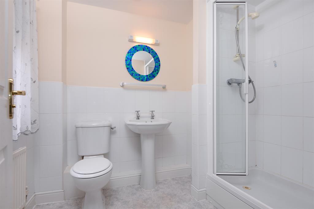 88m (6' 2") (MAX) Panel bath with tiled surround, half tiled walls, tiled shower cubicle, wash hand basin, radiator and w/c. BEDROOM TWO 4.95m (16' 3") (MAX) - 3.
