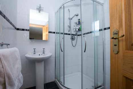 ENSUITE SHOWER ROOM: Fully tiled shower cubicle with thermostatic shower. Low flush WC. Pedestal wash hand basin. Fully tiled walls and floor. BEDROOM (4): 14 7 x 11 9 (4.44m x 3.