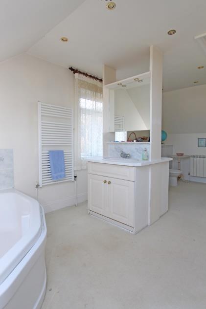 En suite 16 x 10 Fitted with a 6 piece suite comprising large corner bath, his n hers sinks set on