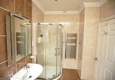 18m) Fitted with a luxurious four piece suite comprising fully tiled walk-in shower cubicle with power shower, panelled bath, pedestal wash hand basin and low flush toilet.