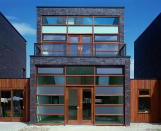 mentioning is the large window on the garden side which is made using a wooden curtain facade profile The