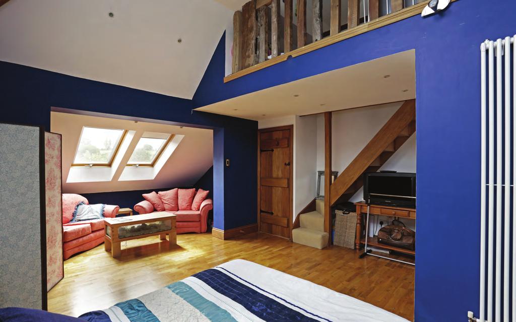The galleried mezzanine in the second bedroom is adored by the owners
