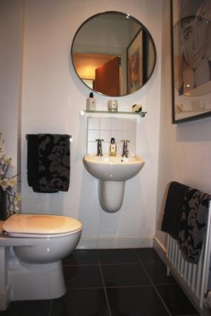Downstairs WC 1.3m (4' 3) x 1.3m (4' 3) Entered from reception hallway and with matching polished marble floor tiling.