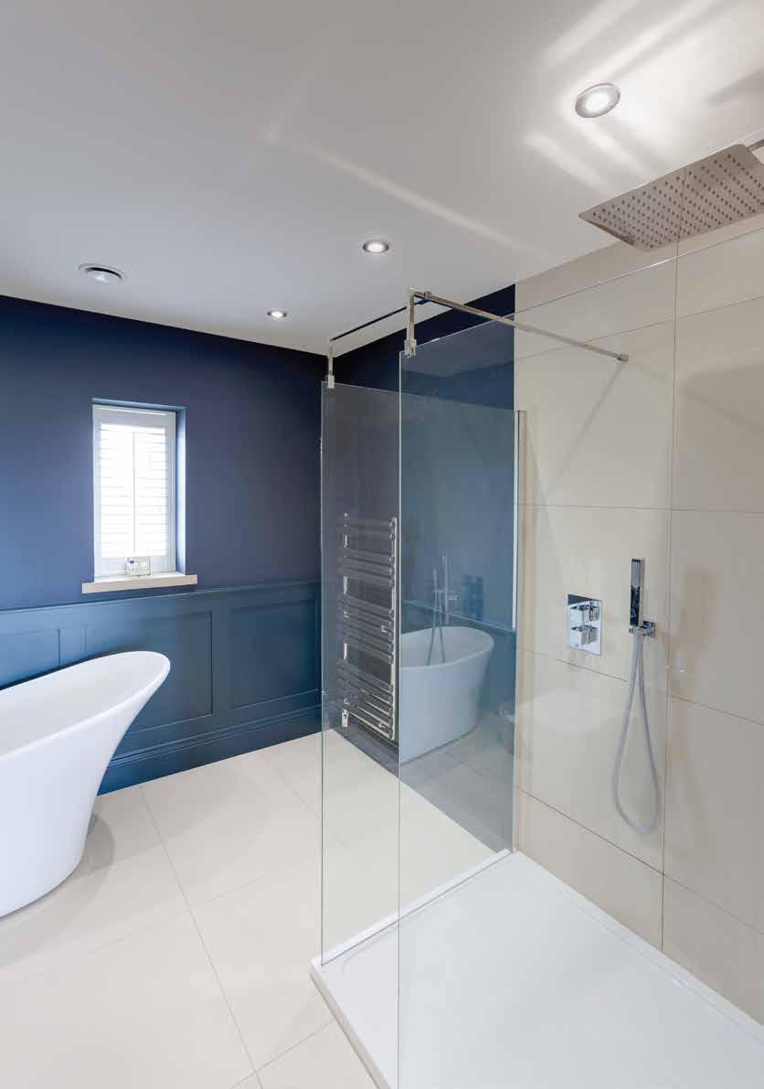 chrome heated towel rail, wainscot panelling and tiled flooring with under floor heating.