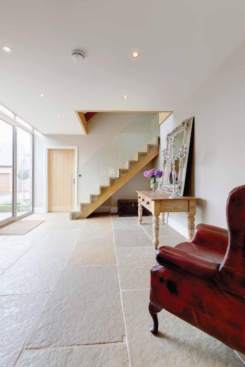 Entrance Hallway Having recessed lighting, deep skirtings, stone flagged flooring with under floor heating and telephone entry system for the gates. Doors give access to the lounge and dining kitchen.