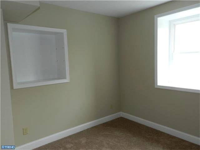 utility room w/ tile flooring, half bath, laundry hook-ups & outside exit to new