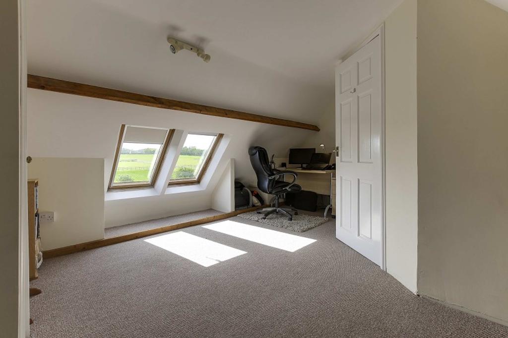 SECOND FLOOR LANDING Doors to loft rooms. LOFT ROOM ONE 14 7 x 13 8 (4.46m x 4.20m) With some restricted head height. Two double glazed Velux windows to rear. Good sized storage cupboard. Carpet.